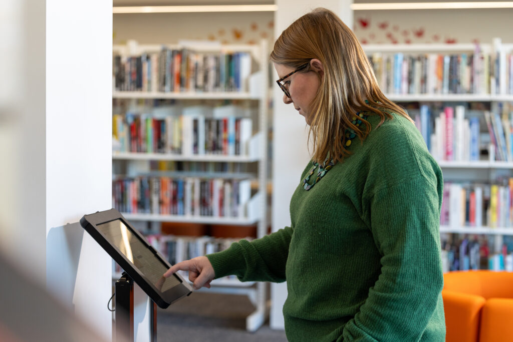 Lady searching catalogue at at Moss Vale Library