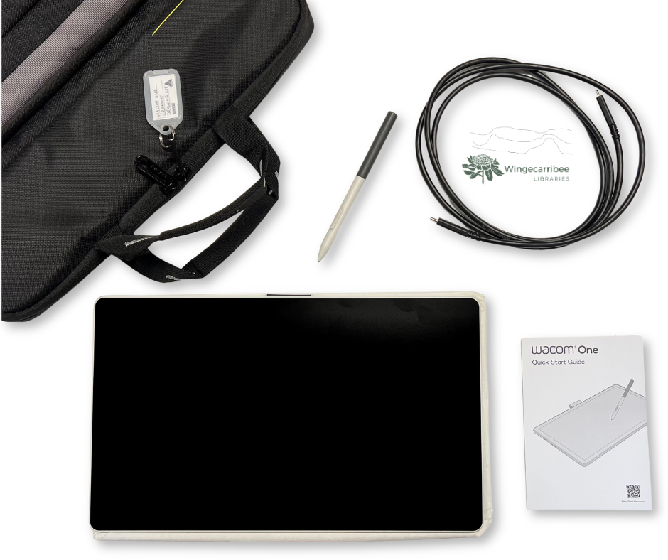 Creative Drawing Kit on a table to show its contents: a black laptop bag in the top left corner, the drawing tablet at the bottom left with the pen sitting above it, with the power cord to the right and an instruction booklet in the bottom right.