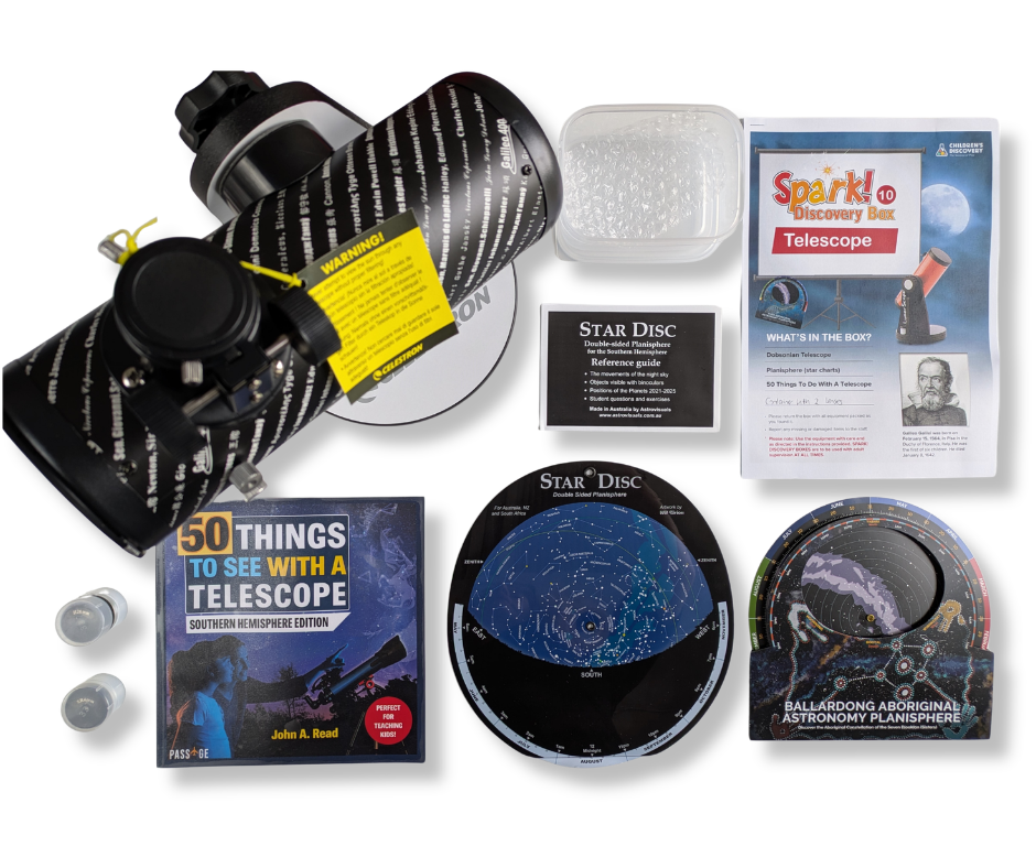 Telescope kit contents laid out on a white table.
